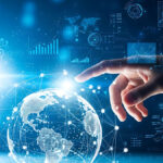 Digital transformation and global connectivity symbolized by a hand interacting with a glowing earth network